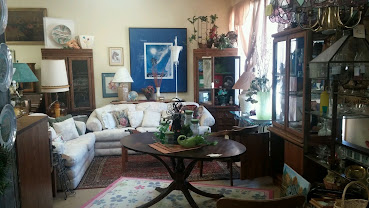 Storefront window with thrift shop art
